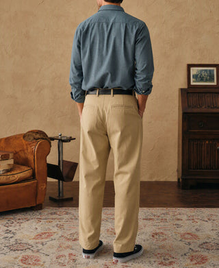 Royal blue flannel work shirt from back view with tan pants
