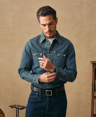 Washed denim western shirt worn by model: button-front with pointed collar and chest snaps