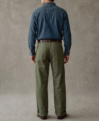 Olive deck pants on model from behind, showing full length and straight leg shape.