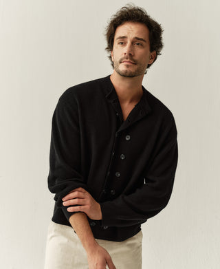 Men's black knit cardigan, double-breasted front with dark button placket