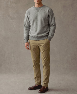 Heather gray crewneck sweatshirt with V-shaped neckline, long sleeves, ribbed cuffs