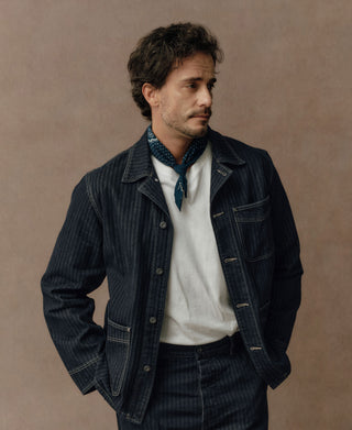 Indigo herringbone denim jacket with pointed collar, button front, chest pocket