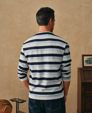 Men's striped long-sleeve T-shirt from back; navy and light blue bands