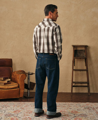 Beige and dark plaid western shirt, full back view with buttoned yoke