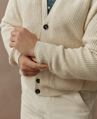 Natural cotton rib cardigan with button front, deep V-neck and ribbed cuffs