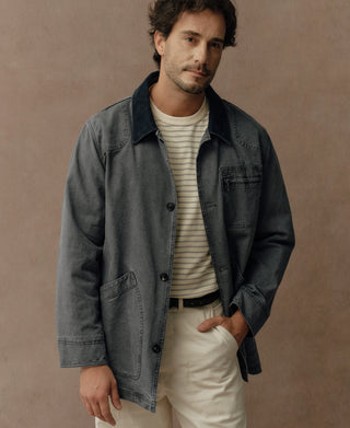 Gray-blue canvas jacket side view with chest flap pocket and buttons