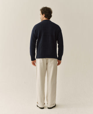 Back view of navy wool sweater with rib-knit upper panel