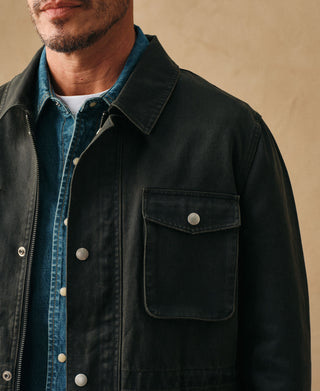 Black olive field jacket with snap-flap chest pocket, button placket, and collar