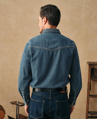 Washed denim western shirt back view with yoke seam, long sleeves, and contrast stitching