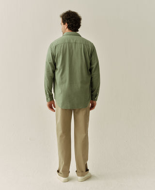 Back view of sage brushed flannel work shirt with long sleeves and yoke