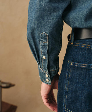 Blue denim western shirt with snap cuffs and chest pocket, long sleeves
