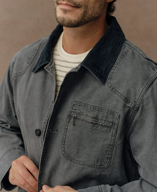 Gray-blue jacket chest pocket with flap and zipper detail