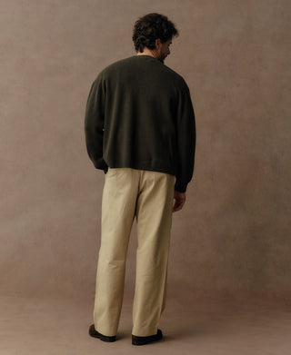 Olive knit cardigan back view with full sleeves and ribbed hem