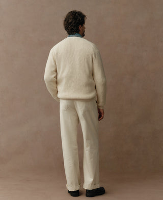 Natural cotton cardigan shown from the back, with a relaxed fit and ribbed hem