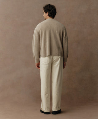 Ecru knit cardigan back view with long sleeves and rounded hem