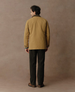 Back view of khaki canvas field jacket with plain back and button cuffs.