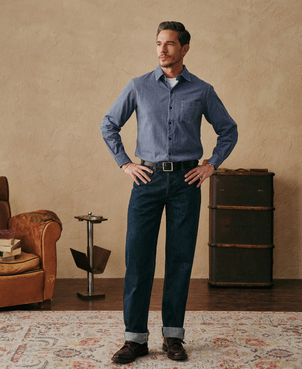 Indigo denim jeans with dark belt, straight legs