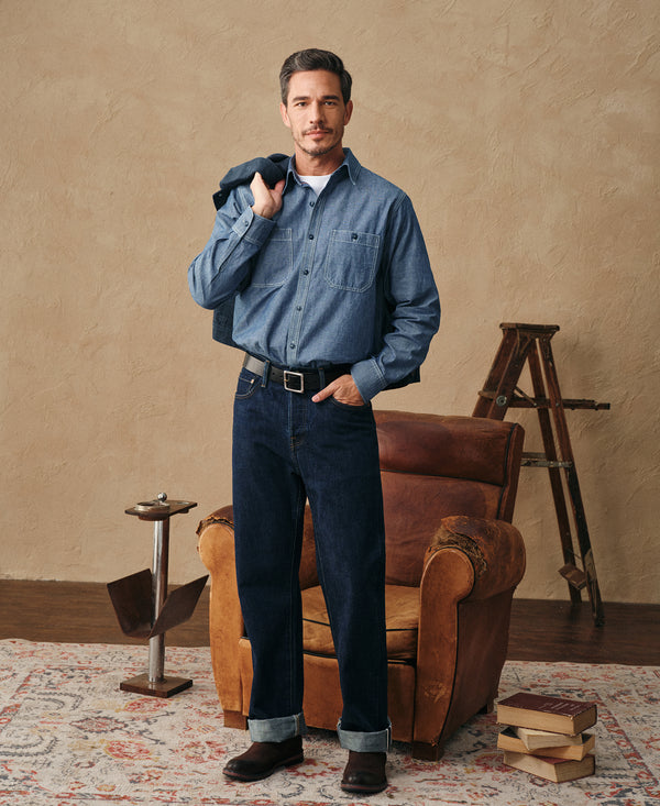 Denim-blue chambray workshirt with two chest pockets and buttoned front, full view