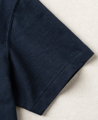 Navy T-shirt side view showing smooth short-sleeve hem