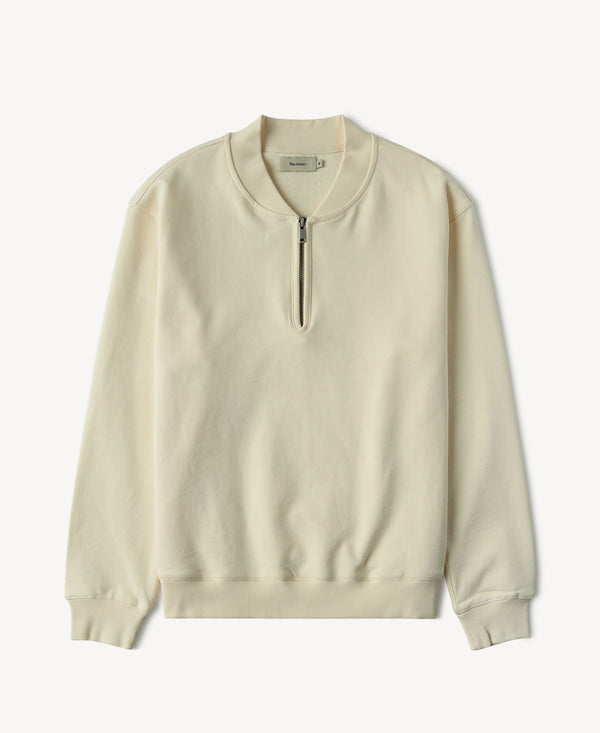 Apricot quarter-zip baseball sweatshirt with ribbed neck, cuffs, and hem